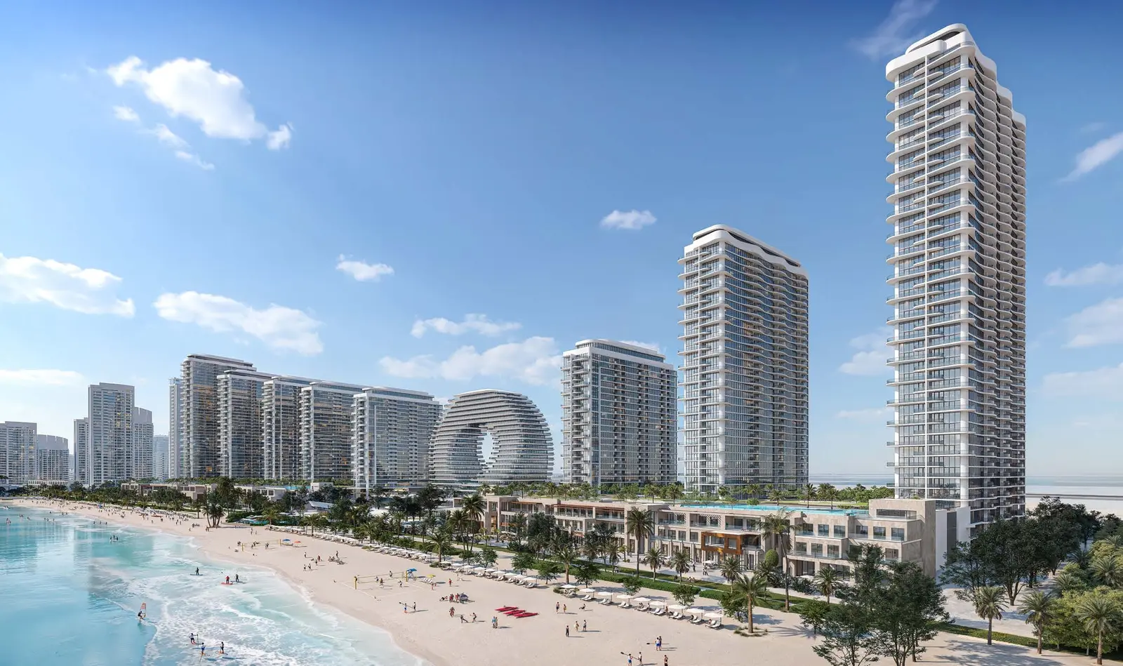 Modern coastal towers and beachfront promenade facing Arabian Gulf waters near Capeside Marina Residences on Sobha Siniya Island Umm Al Quwain.