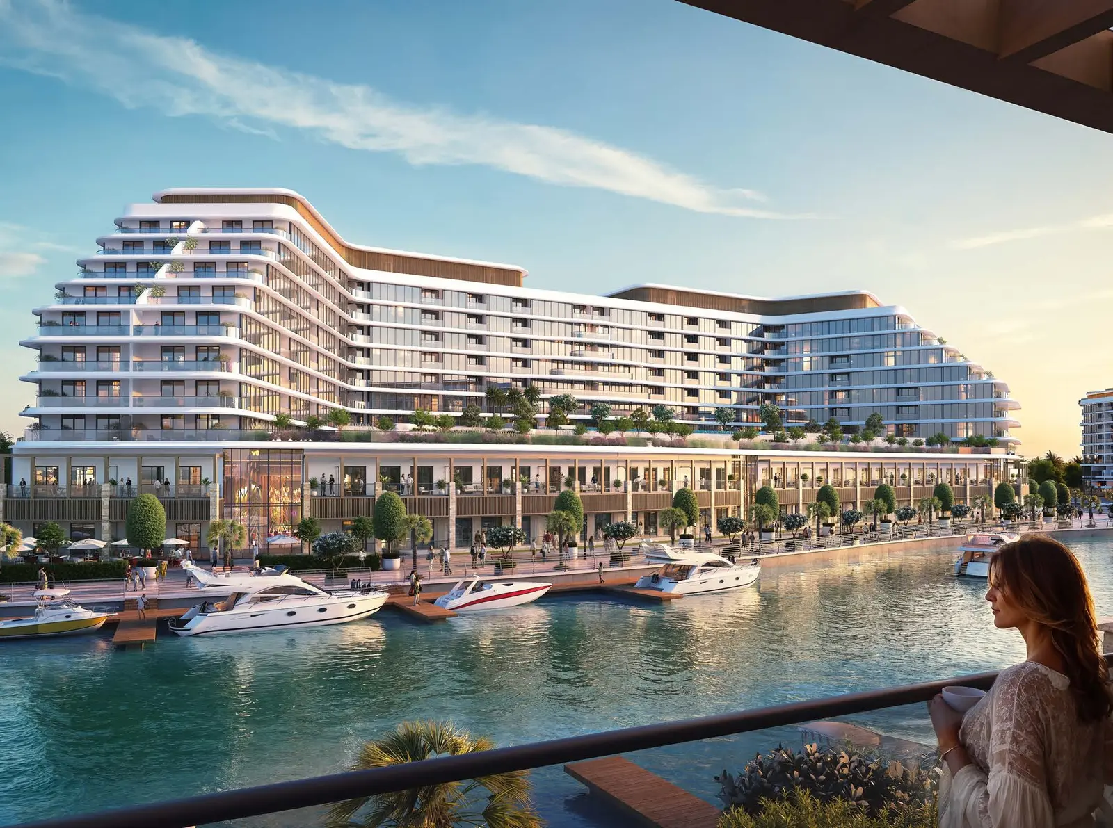 Balcony view overlooking luxury marina promenade, berthed yachts, and residential architecture at Pearlside Marina Residences Sobha Siniya Island.