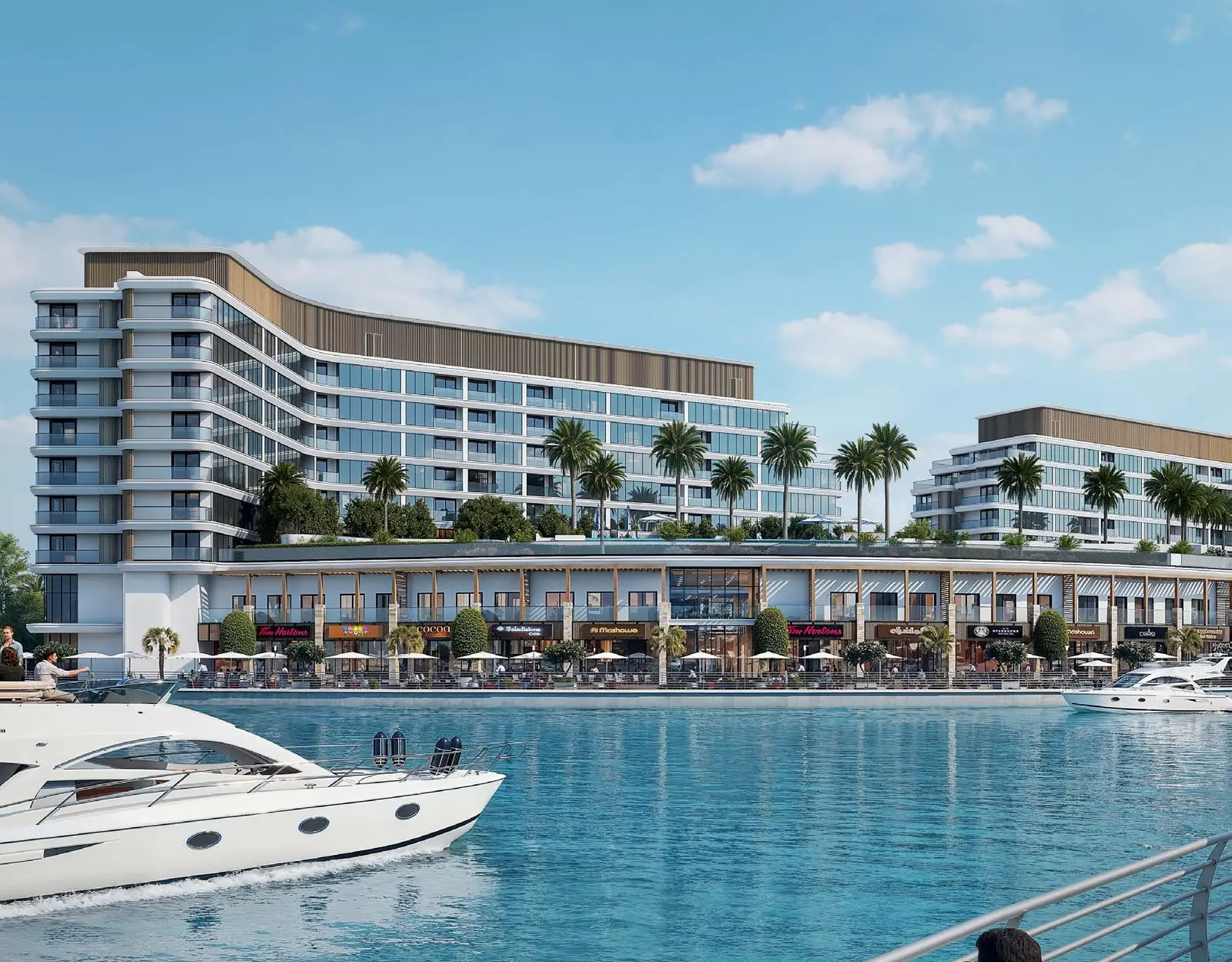 Waterfront promenade, ground level retail shops, and podium facade at pearlside Marina Residences on Sobha Siniya Island Umm Al Quwain.   Copy