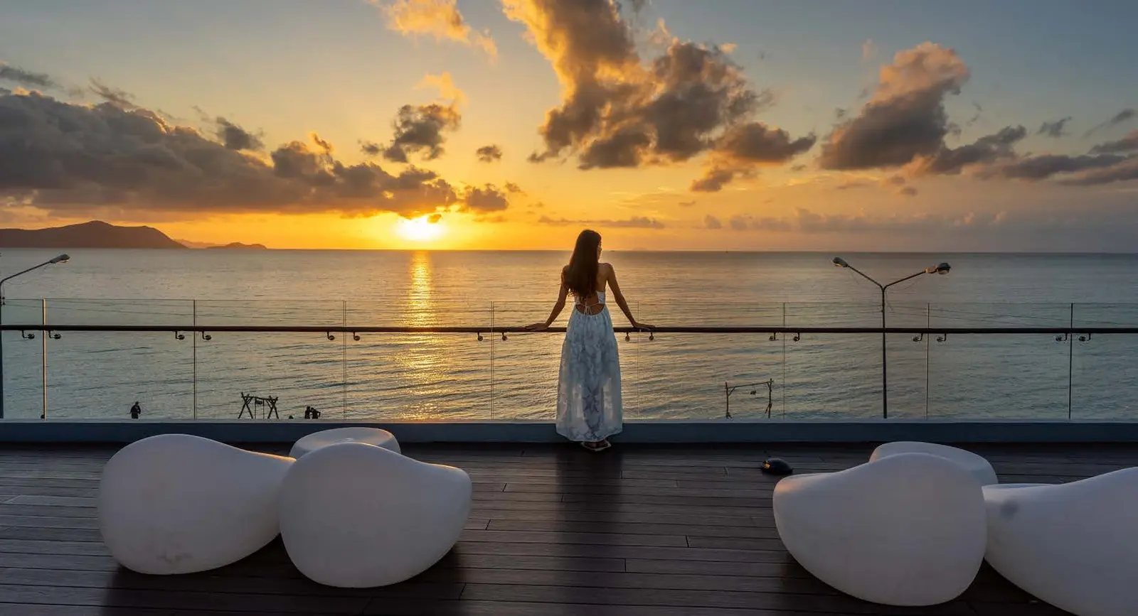 Yachtside Marina Residences at Sobha Siniya Island rooftop lounge terrace offering panoramic sunset views over the sea