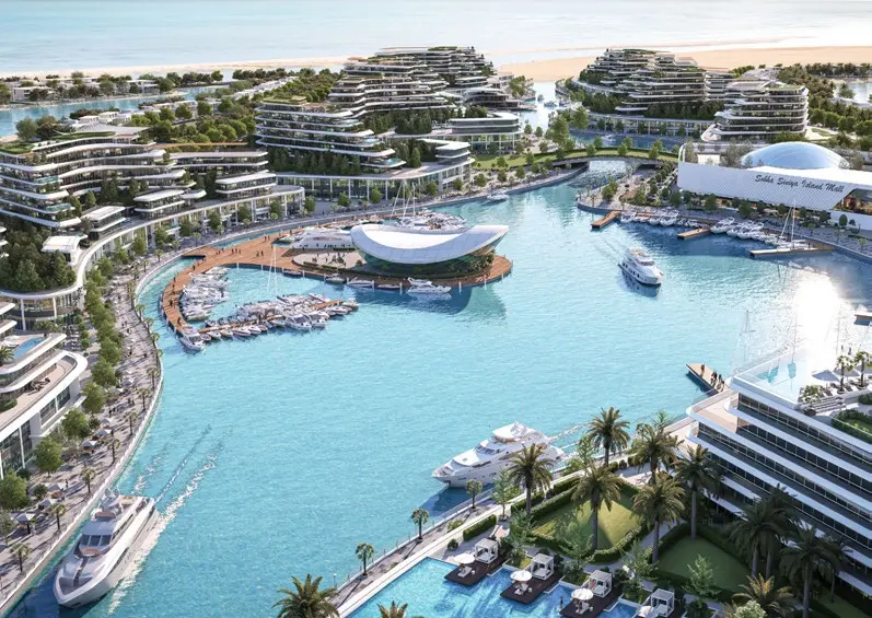 Aerial view of the marina, luxury yachts, and waterfront residential towers at Bayside Marina Residences on Sobha Siniya Island